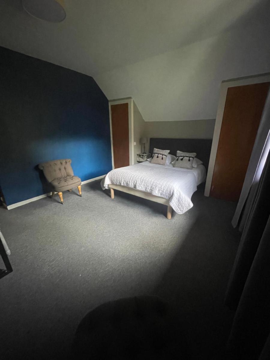 Un ou plusieurs lits dans un hébergement de l'établissement Hôtel Spa & Restaurant Ô Pervenches