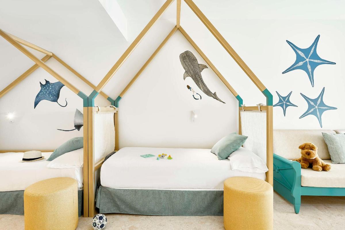 Cama o camas de una habitación en Iberostar Waves Gaviotas Park