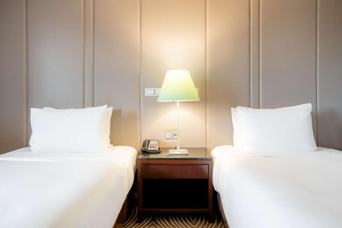 Ein Bett oder Betten in einem Zimmer der Unterkunft Hilton Berlin