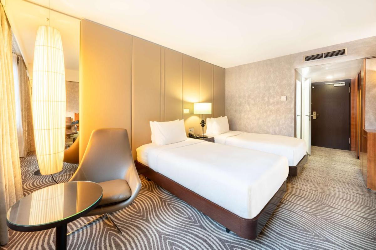 Ein Bett oder Betten in einem Zimmer der Unterkunft Hilton Berlin