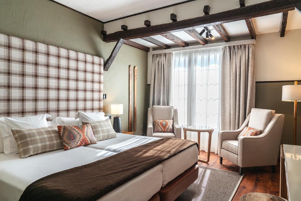Cama o camas de una habitación en Vincci Selección Rumaykiyya
