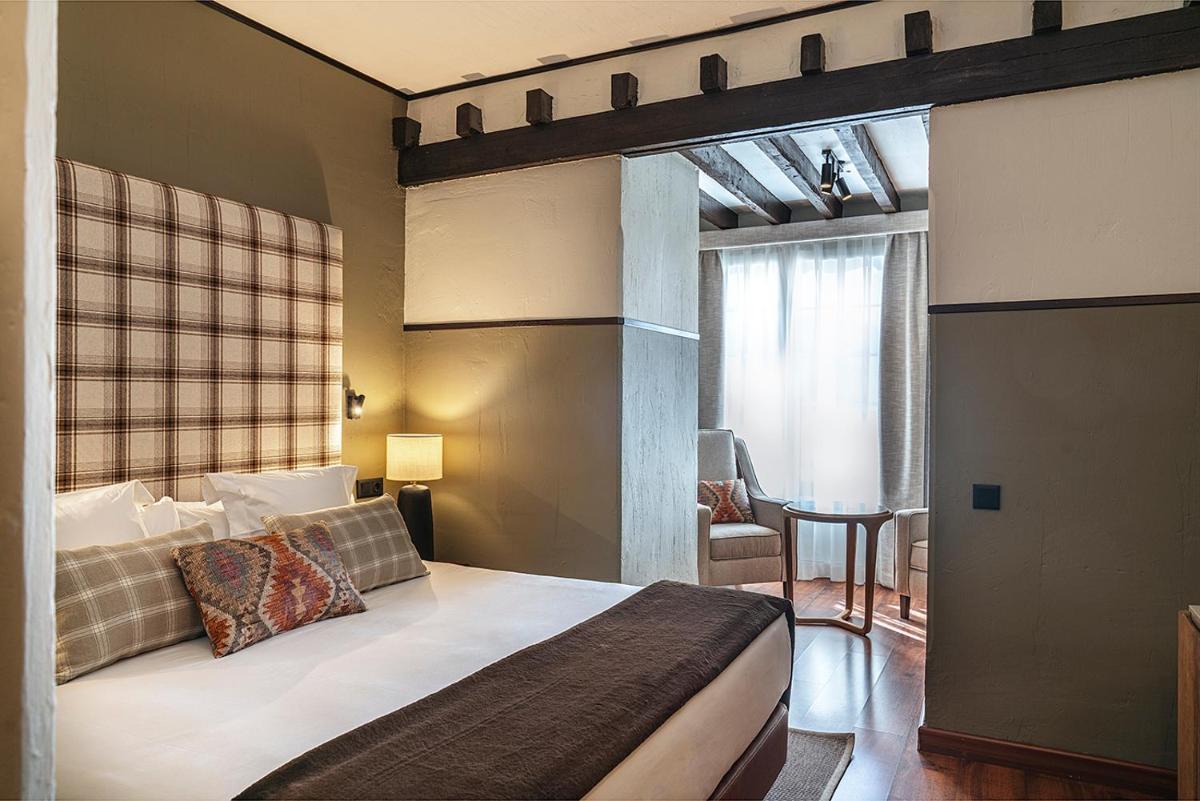 Cama o camas de una habitación en Vincci Selección Rumaykiyya