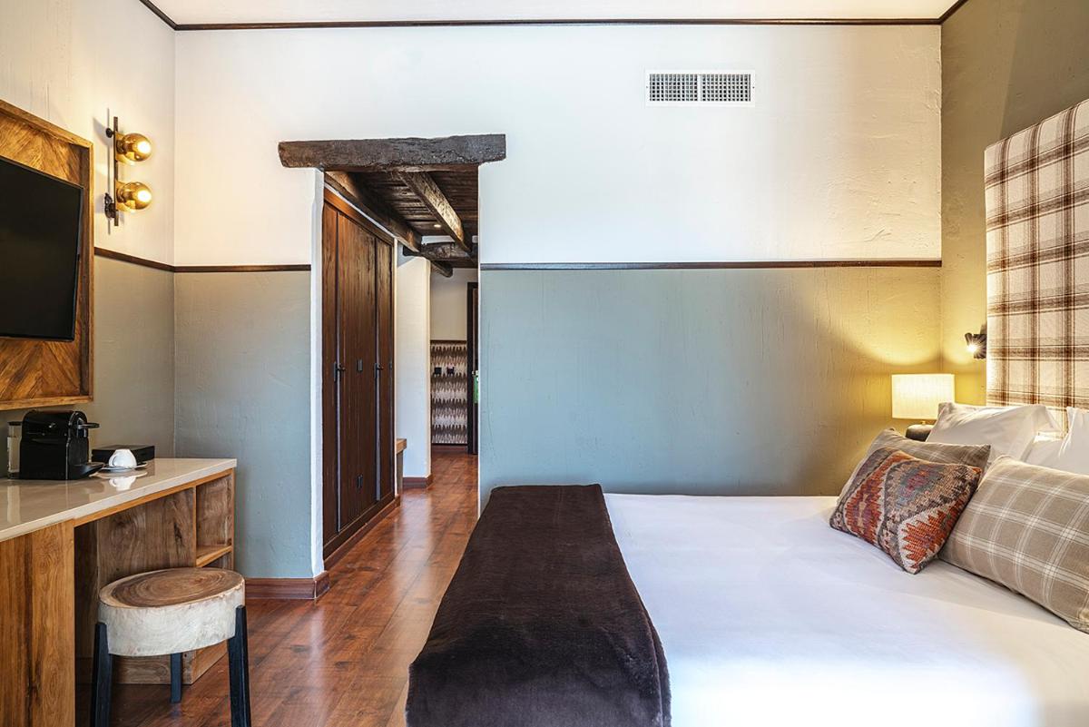 Cama o camas de una habitación en Vincci Selección Rumaykiyya