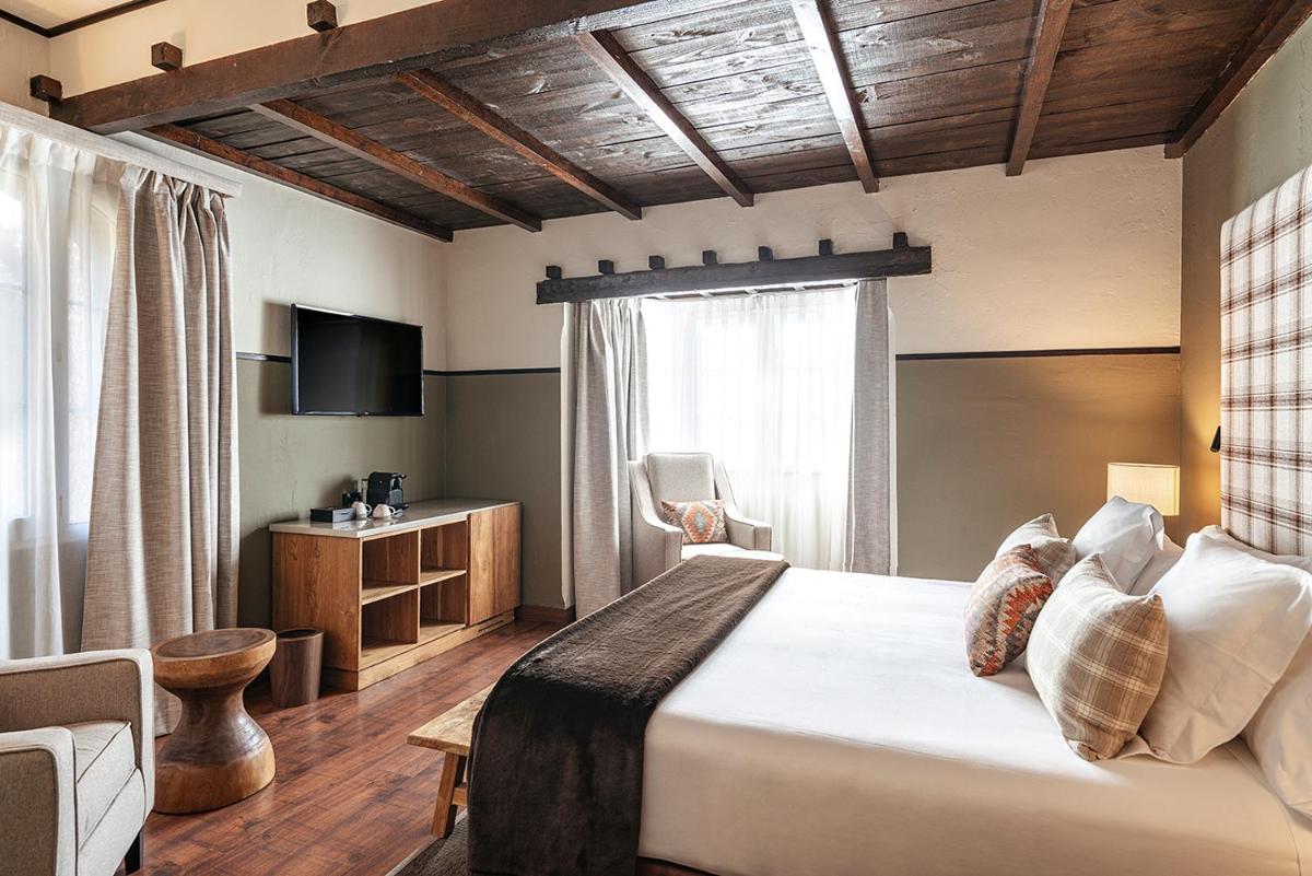 Cama o camas de una habitación en Vincci Selección Rumaykiyya