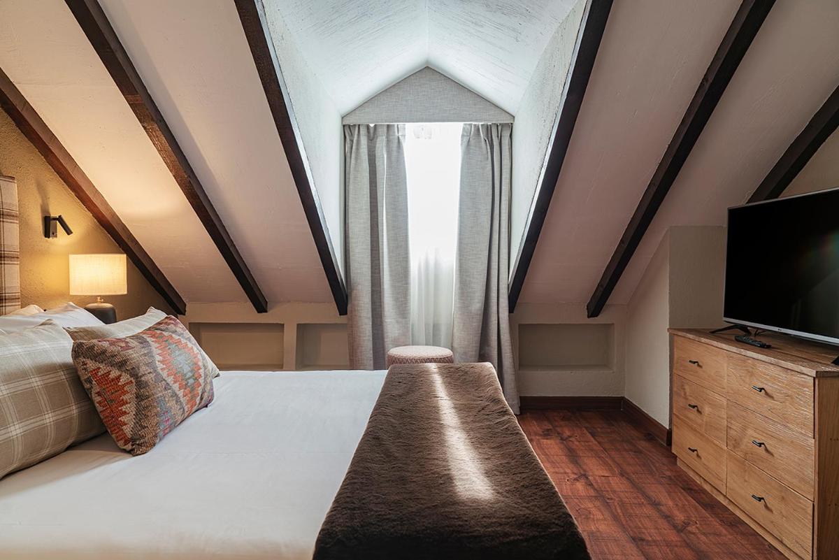 Cama o camas de una habitación en Vincci Selección Rumaykiyya