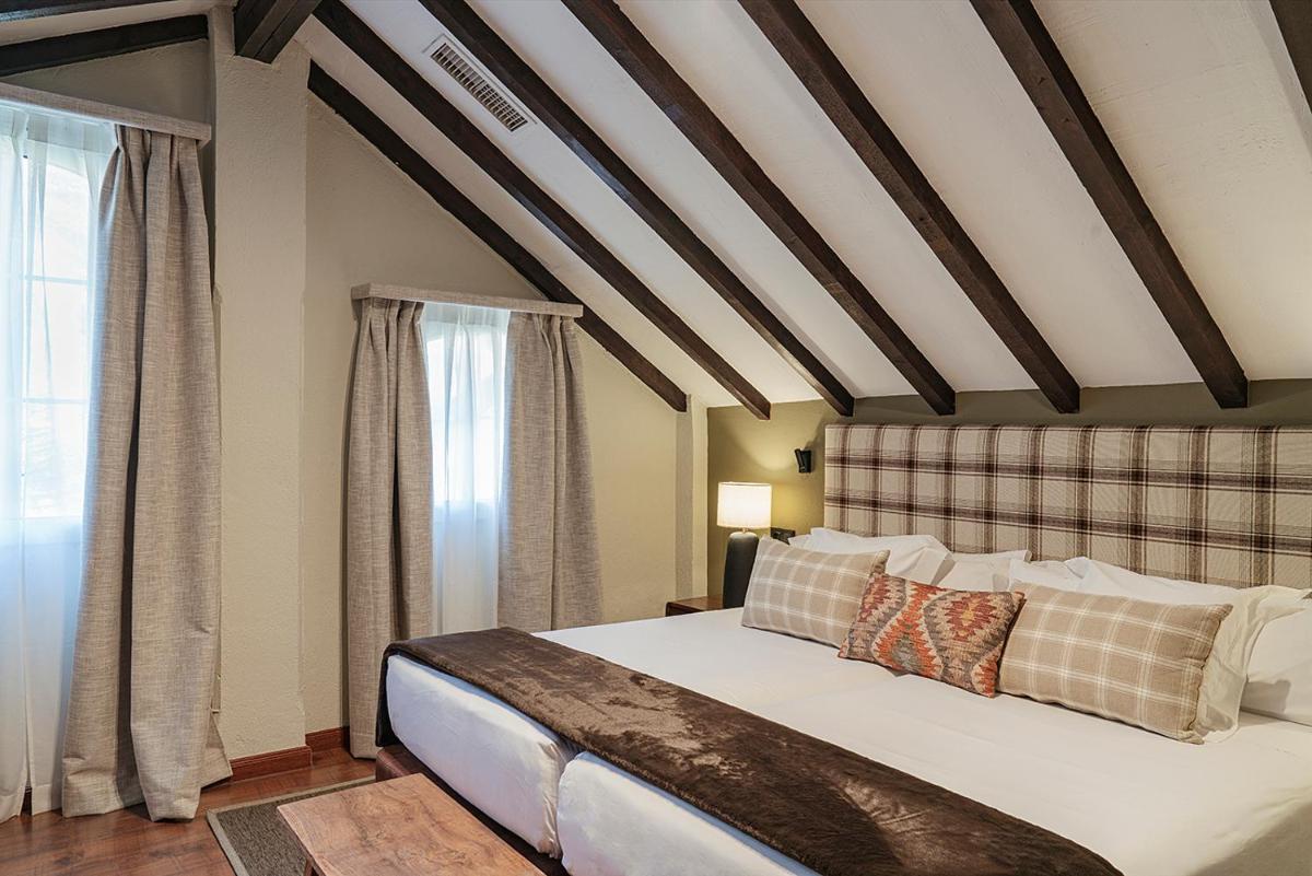 Cama o camas de una habitación en Vincci Selección Rumaykiyya