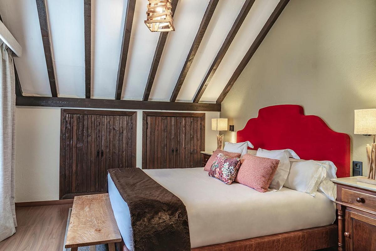 Cama o camas de una habitación en Vincci Selección Rumaykiyya