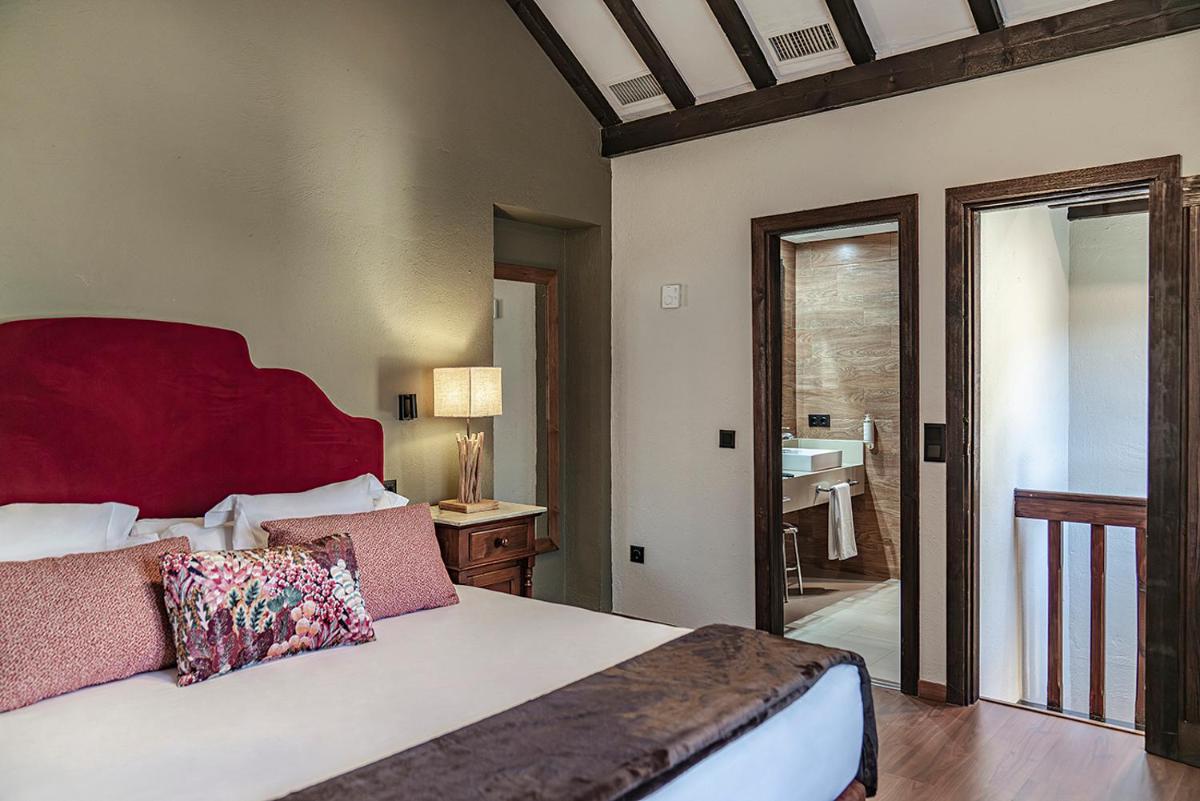 Cama o camas de una habitación en Vincci Selección Rumaykiyya