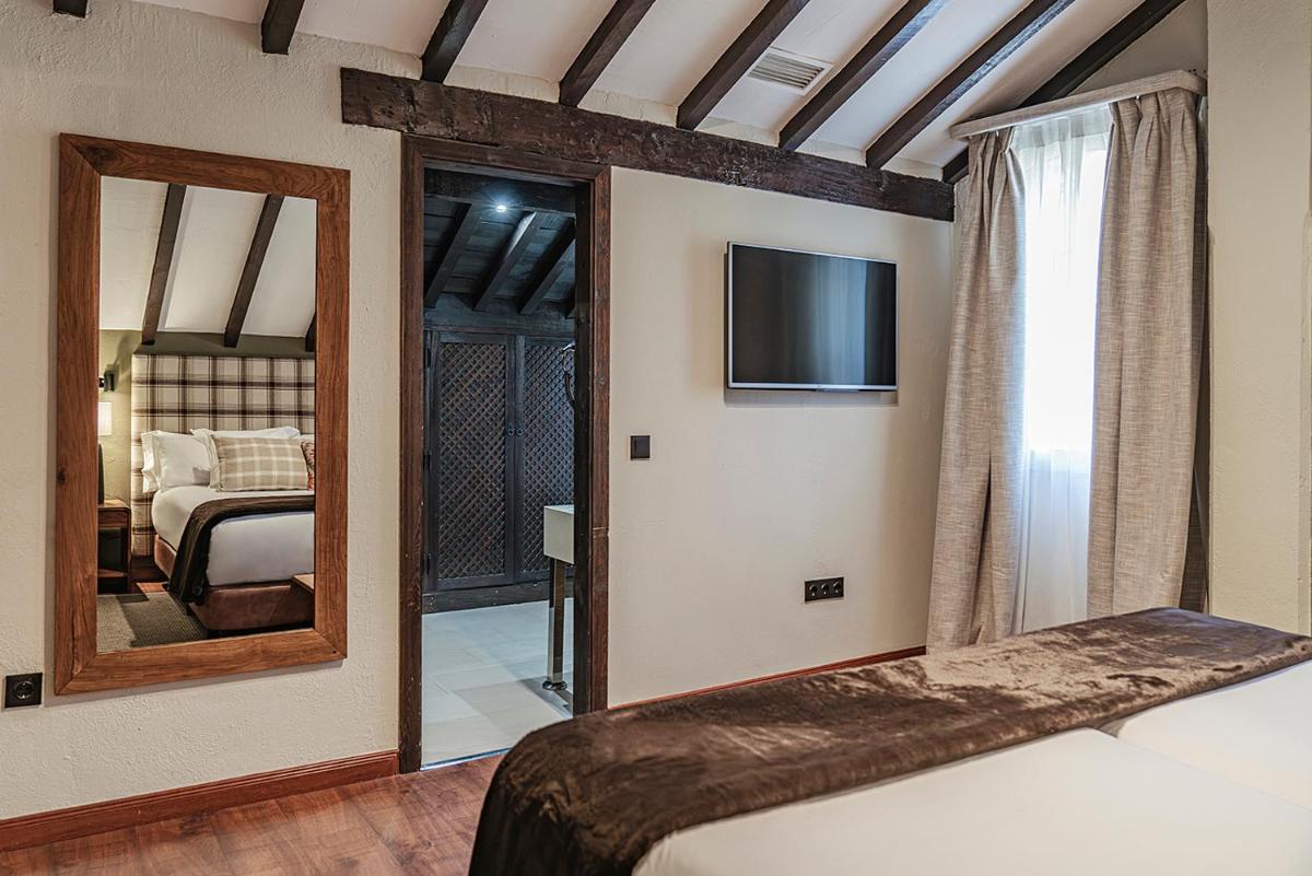 Cama o camas de una habitación en Vincci Selección Rumaykiyya