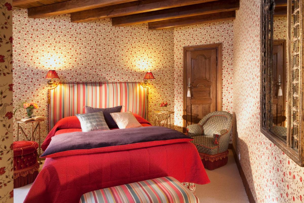 Un ou plusieurs lits dans un hébergement de l'établissement Hotel De France