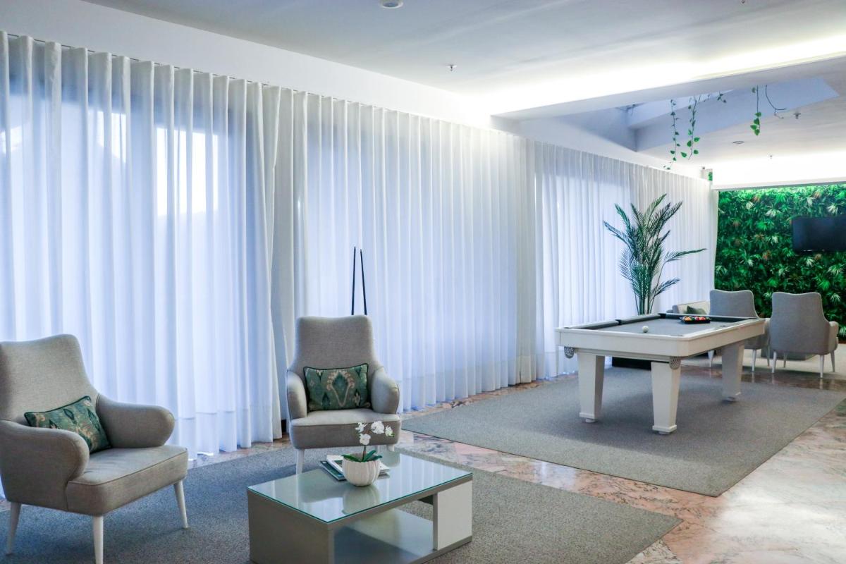 Uma área de estar em Hotel São Bento da Porta Aberta & Spa