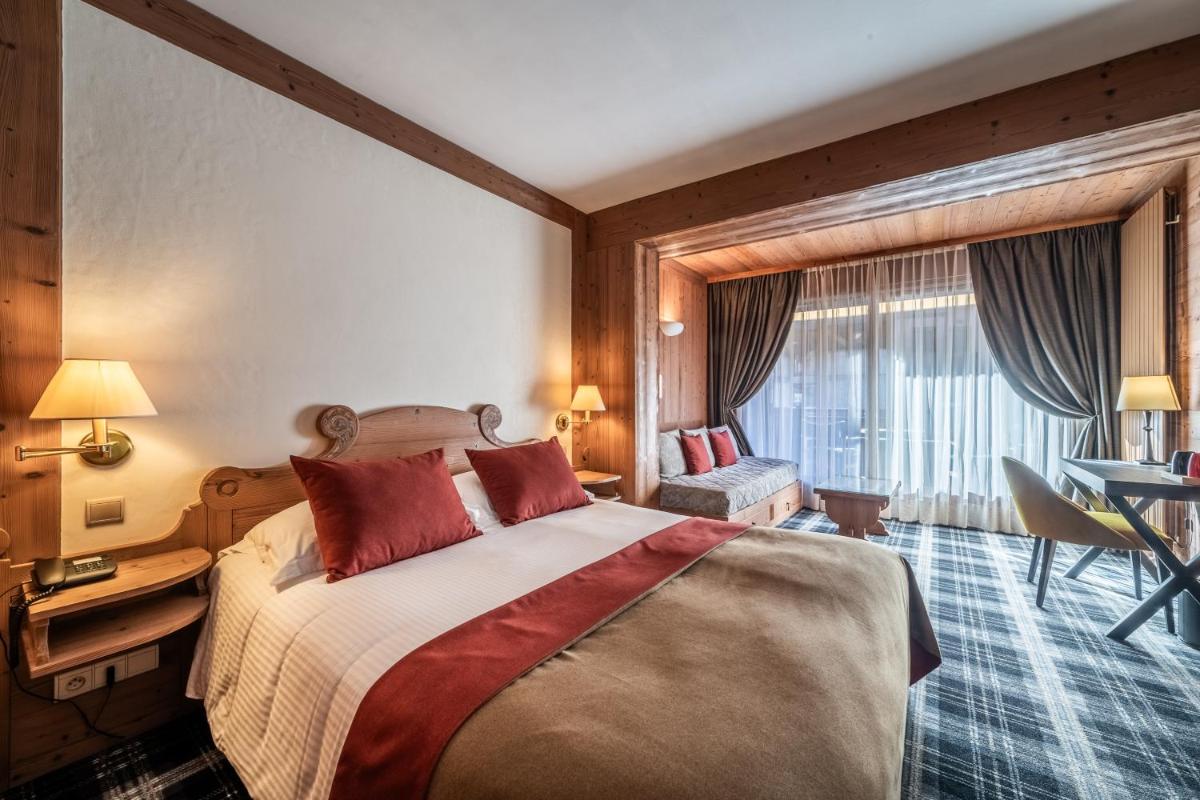 Un ou plusieurs lits dans un hébergement de l'établissement Hotel Le Samoyede