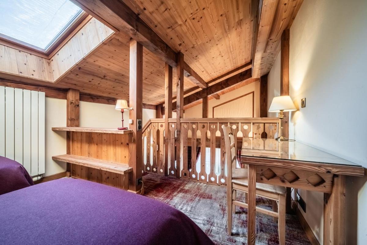 Un ou plusieurs lits dans un hébergement de l'établissement Hotel Le Samoyede