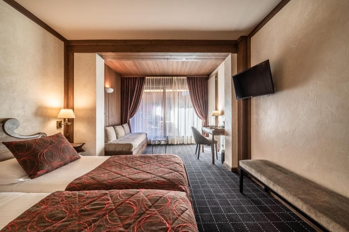 Un ou plusieurs lits dans un hébergement de l'établissement Hotel Le Samoyede