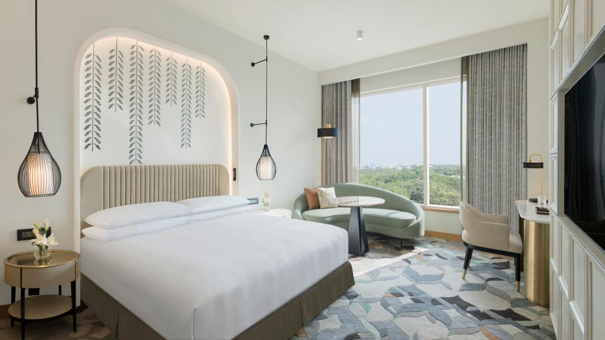 a hotel room with a bed and a tv at InterContinental Jaipur Tonk Road by IHG in Jaipur