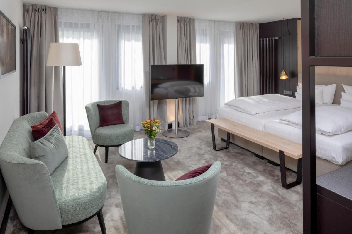 Ein Bett oder Betten in einem Zimmer der Unterkunft Wellness & Genuss Resort - Engel Obertal