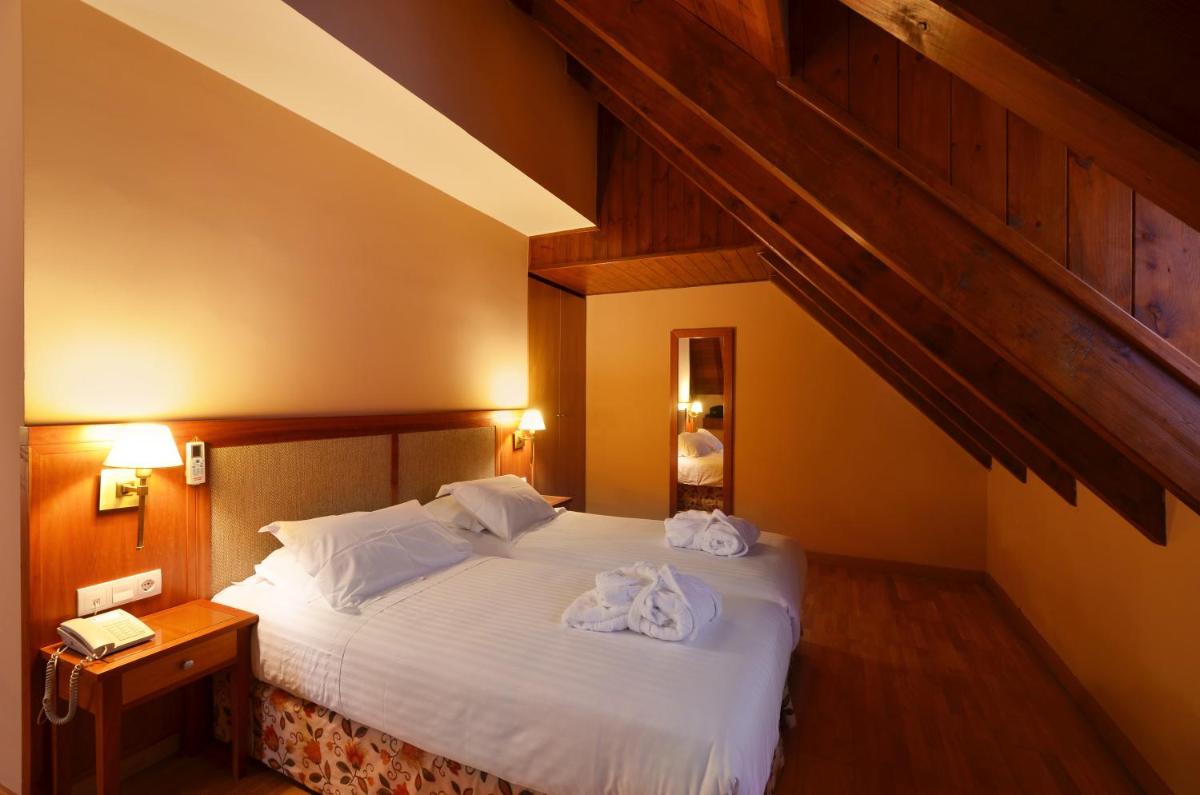Cama o camas de una habitación en Hotel Spa Acevi Val d’Aran