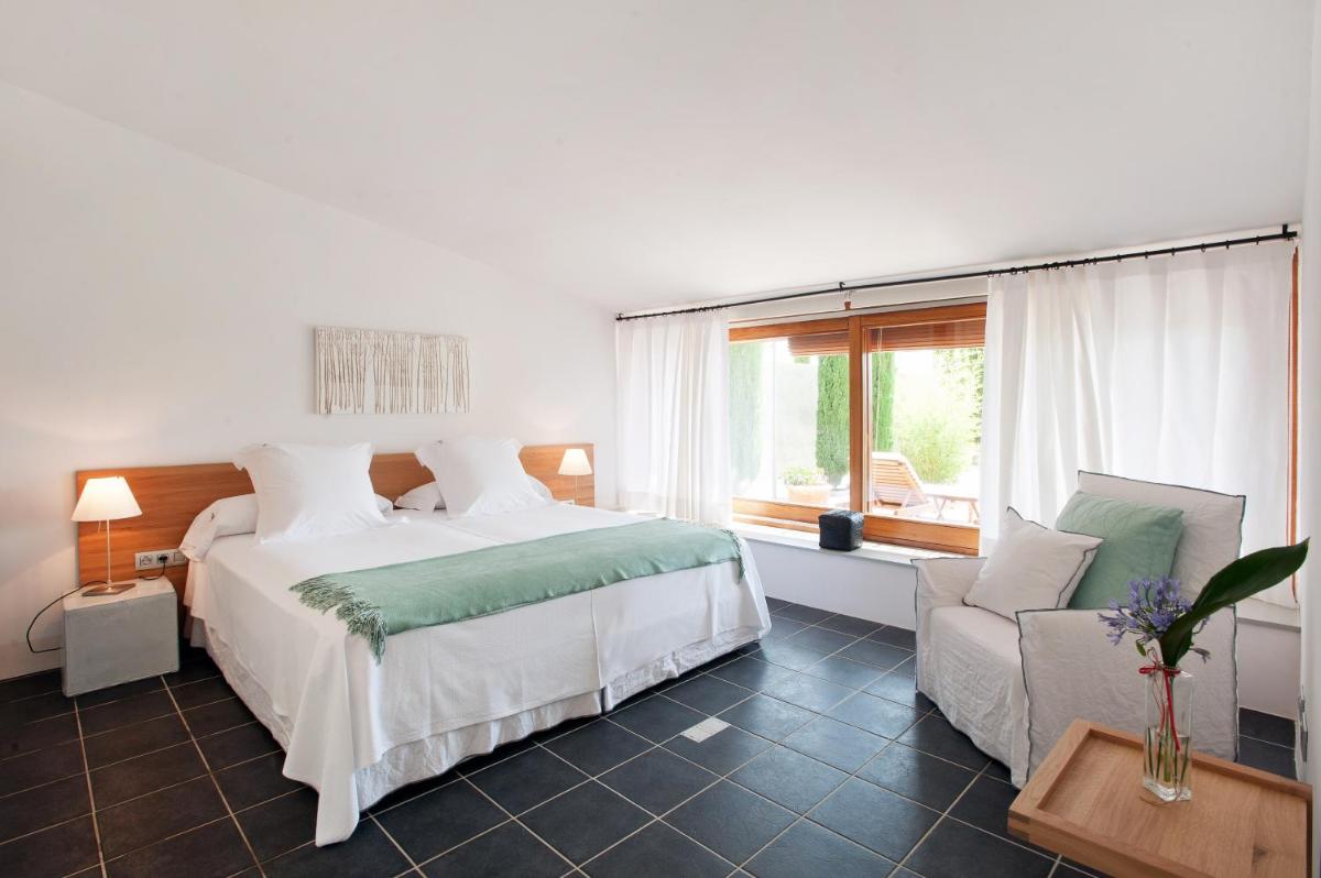Cama o camas de una habitación en Mas Falgarona Hotel Boutique & SPA