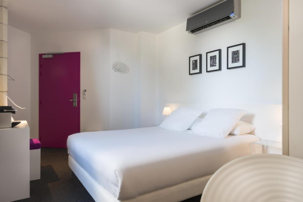 Un ou plusieurs lits dans un hébergement de l'établissement SOZO Hotel