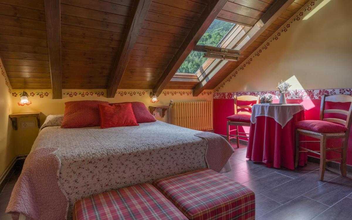 Cama o camas de una habitación en Hotel Aran La Abuela