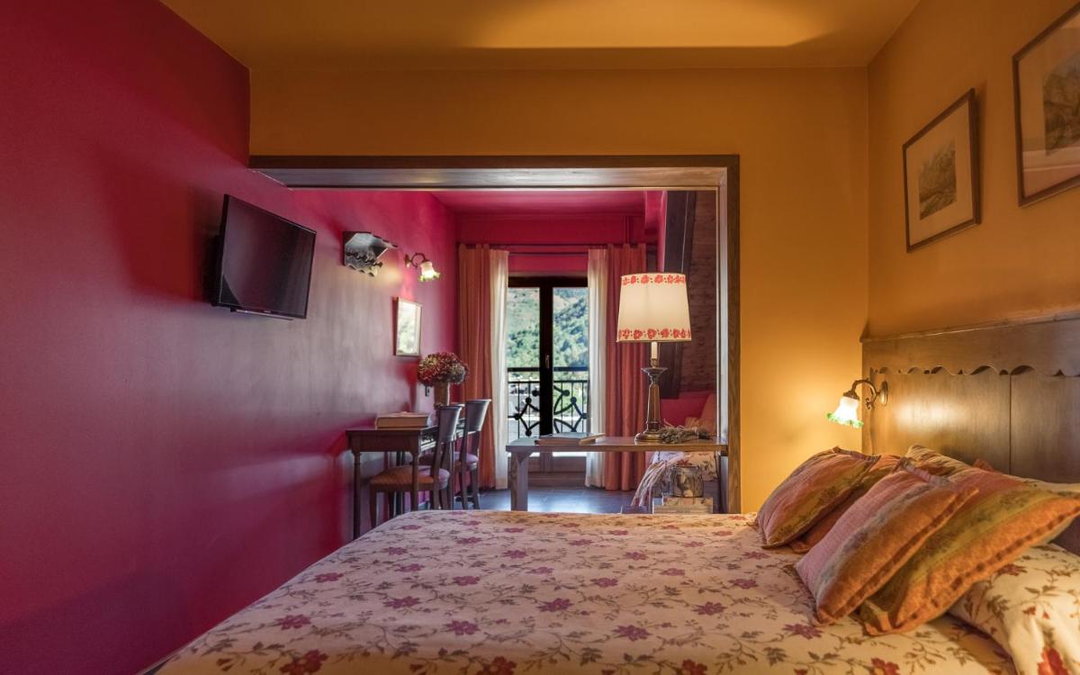 Cama o camas de una habitación en Hotel Aran La Abuela