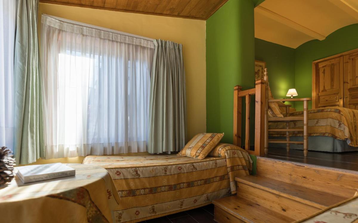 Cama o camas de una habitación en Hotel Aran La Abuela