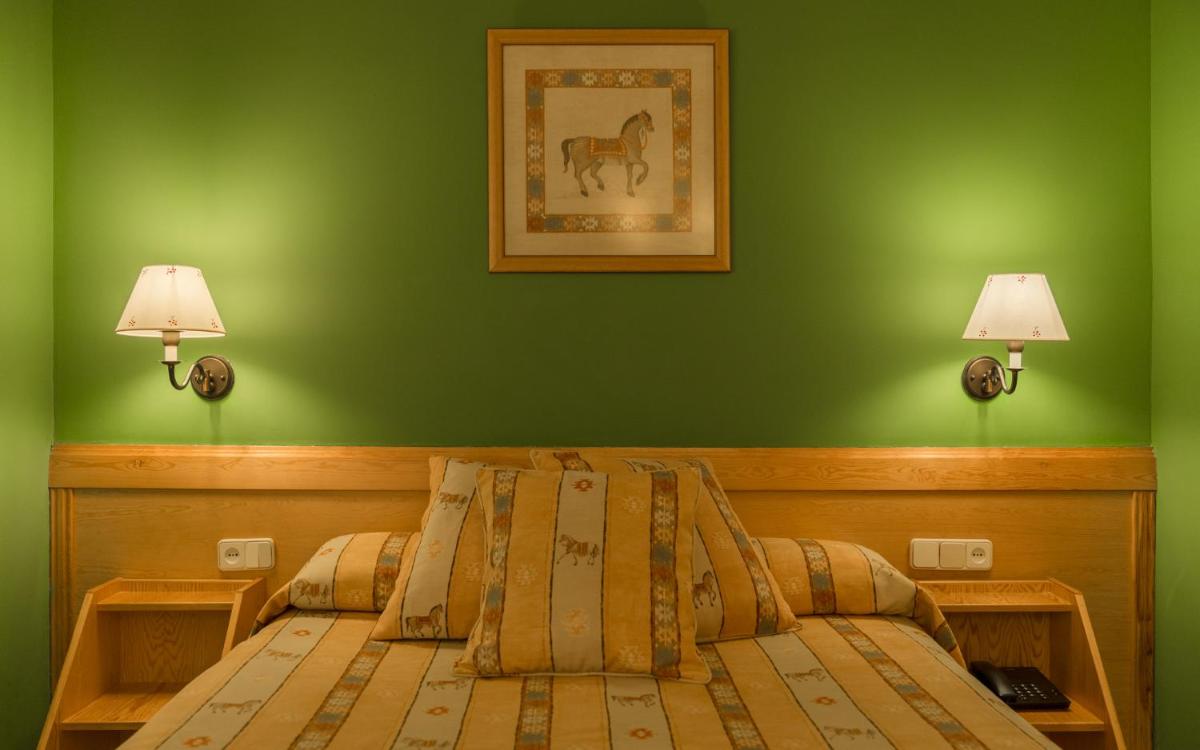 Cama o camas de una habitación en Hotel Aran La Abuela