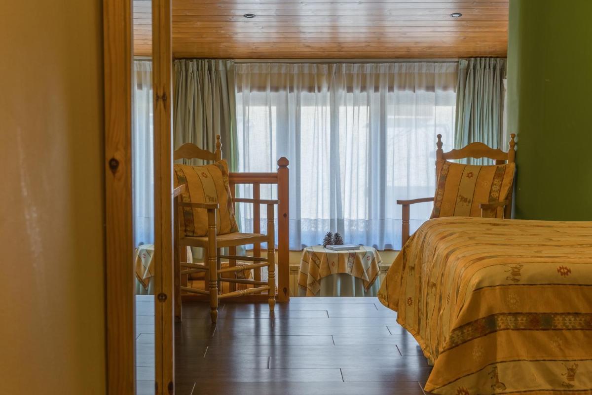 Cama o camas de una habitación en Hotel Aran La Abuela
