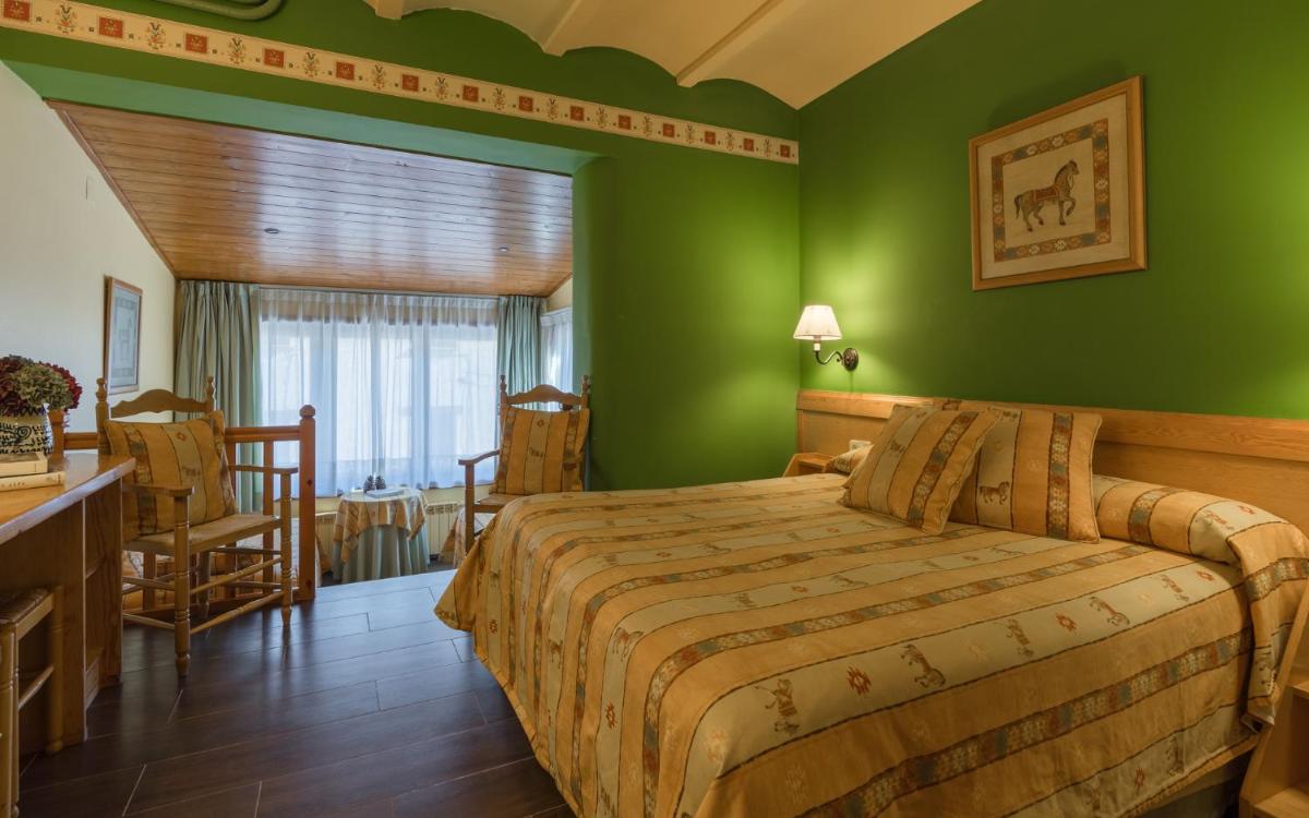 Cama o camas de una habitación en Hotel Aran La Abuela