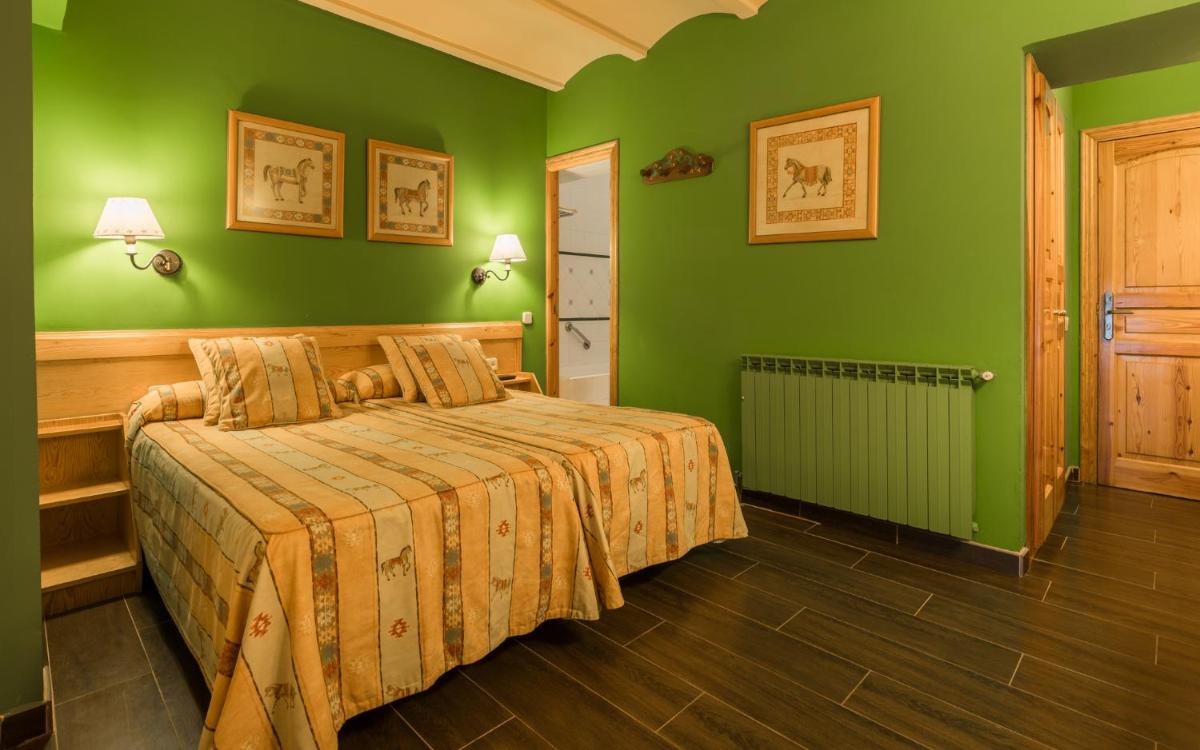 Cama o camas de una habitación en Hotel Aran La Abuela