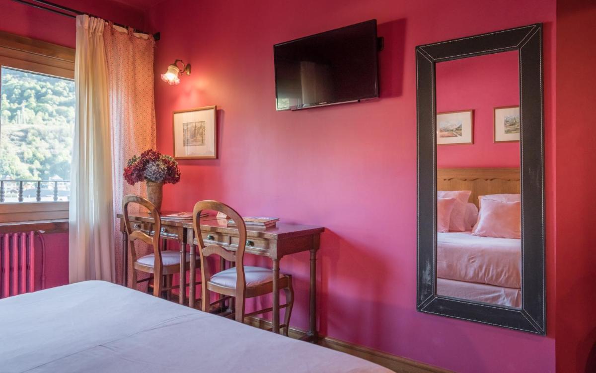 Cama o camas de una habitación en Hotel Aran La Abuela