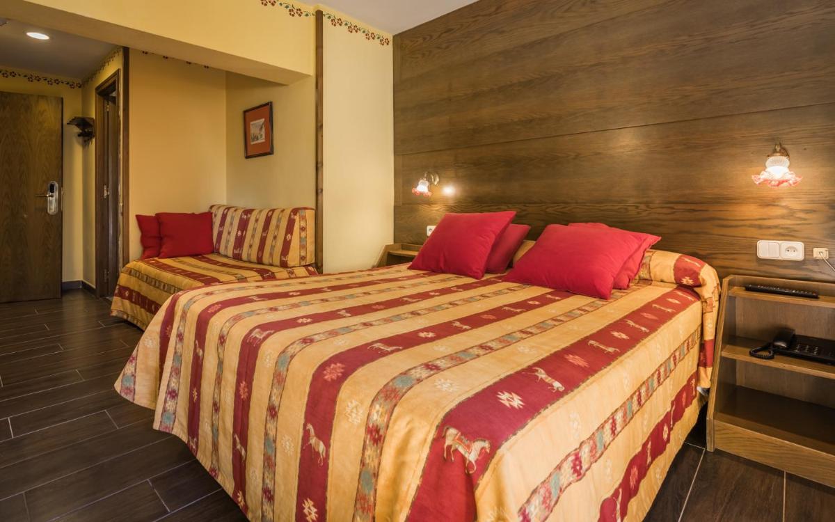 Cama o camas de una habitación en Hotel Aran La Abuela