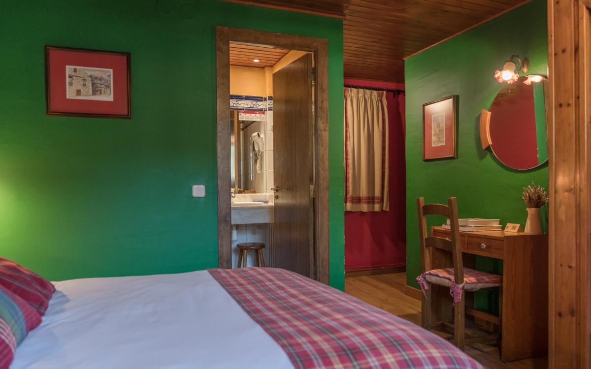 Cama o camas de una habitación en Hotel Aran La Abuela