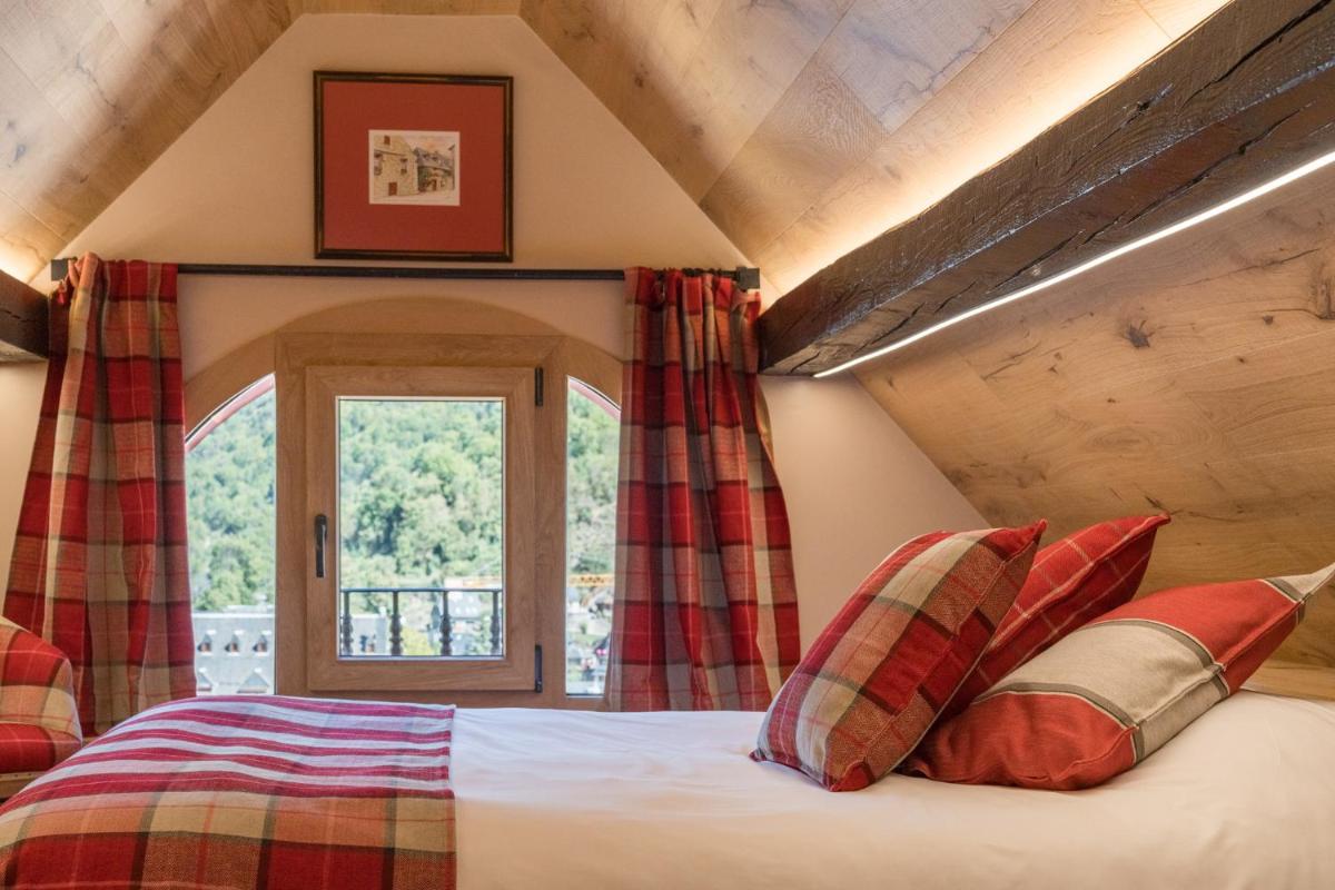 Cama o camas de una habitación en Hotel Aran La Abuela