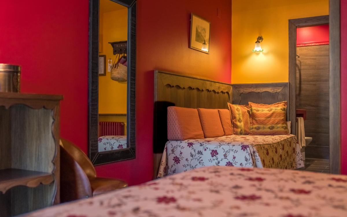 Cama o camas de una habitación en Hotel Aran La Abuela