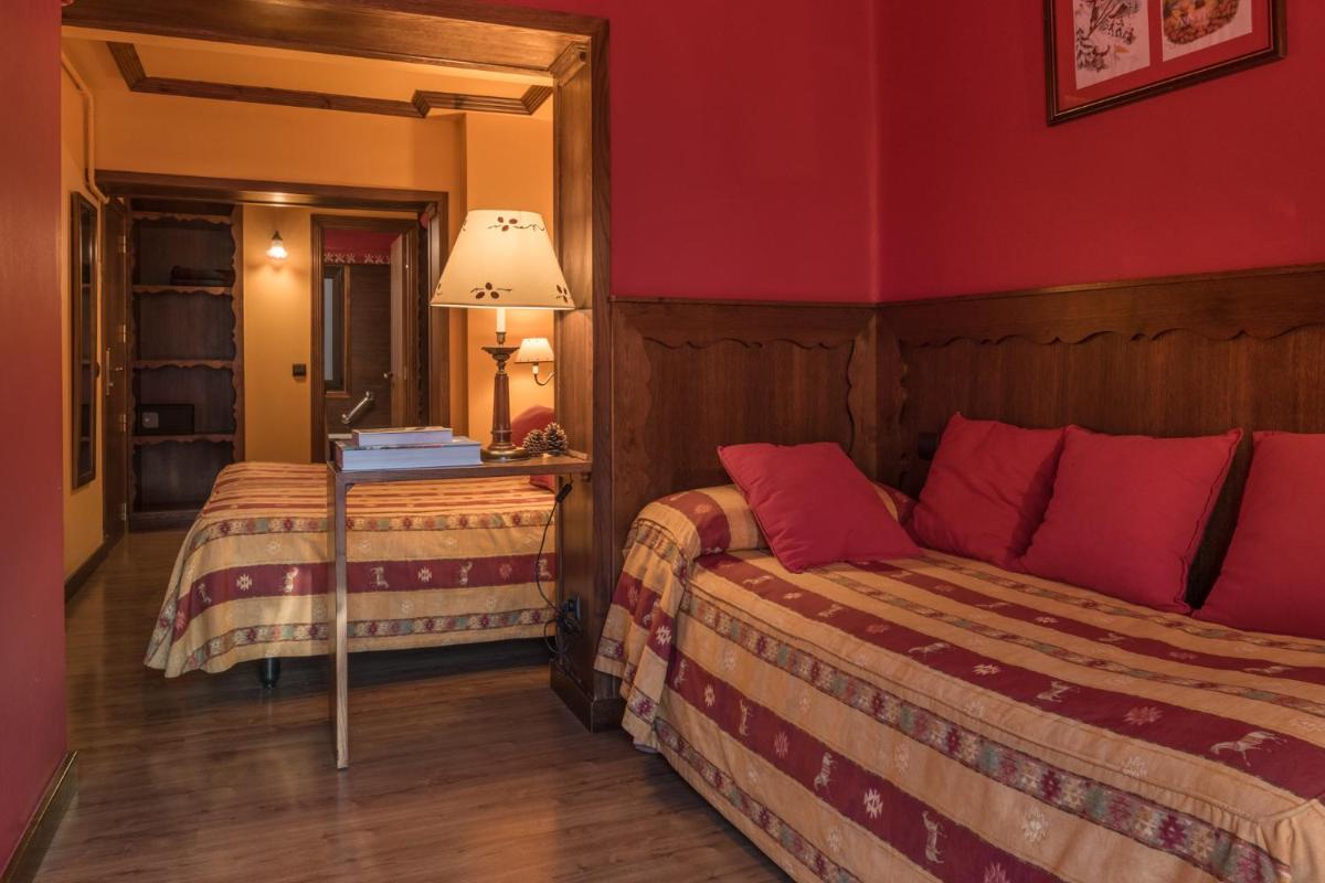 Cama o camas de una habitación en Hotel Aran La Abuela