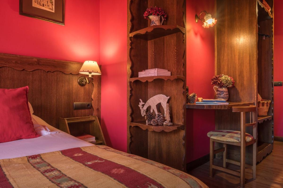 Cama o camas de una habitación en Hotel Aran La Abuela