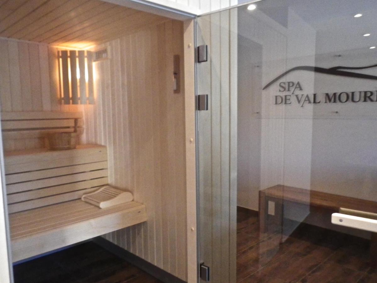 Un ou plusieurs lits dans un hébergement de l'établissement Auberge Val Moureze Hôtel & Spa