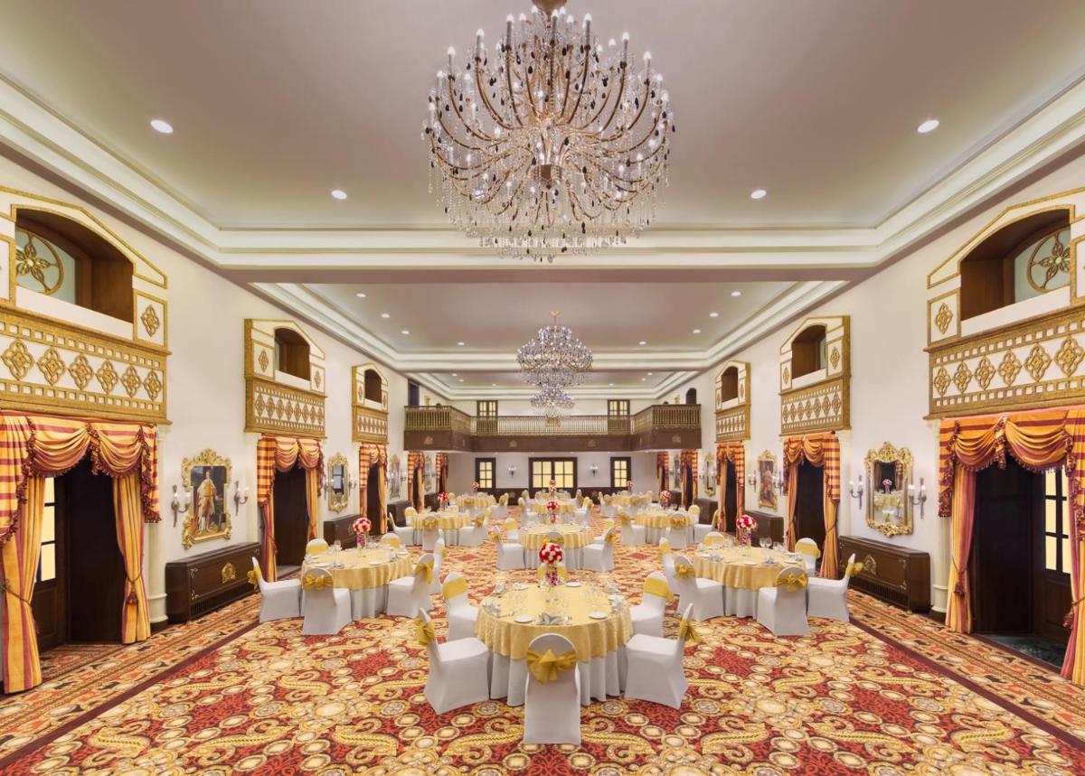 a large banquet hall with tables and a chandelier at Welcomhotel by ITC Hotels, The Savoy, Mussoorie in Mussoorie