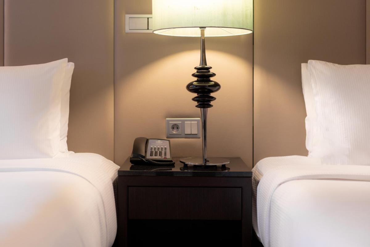 Ein Bett oder Betten in einem Zimmer der Unterkunft Hilton Berlin