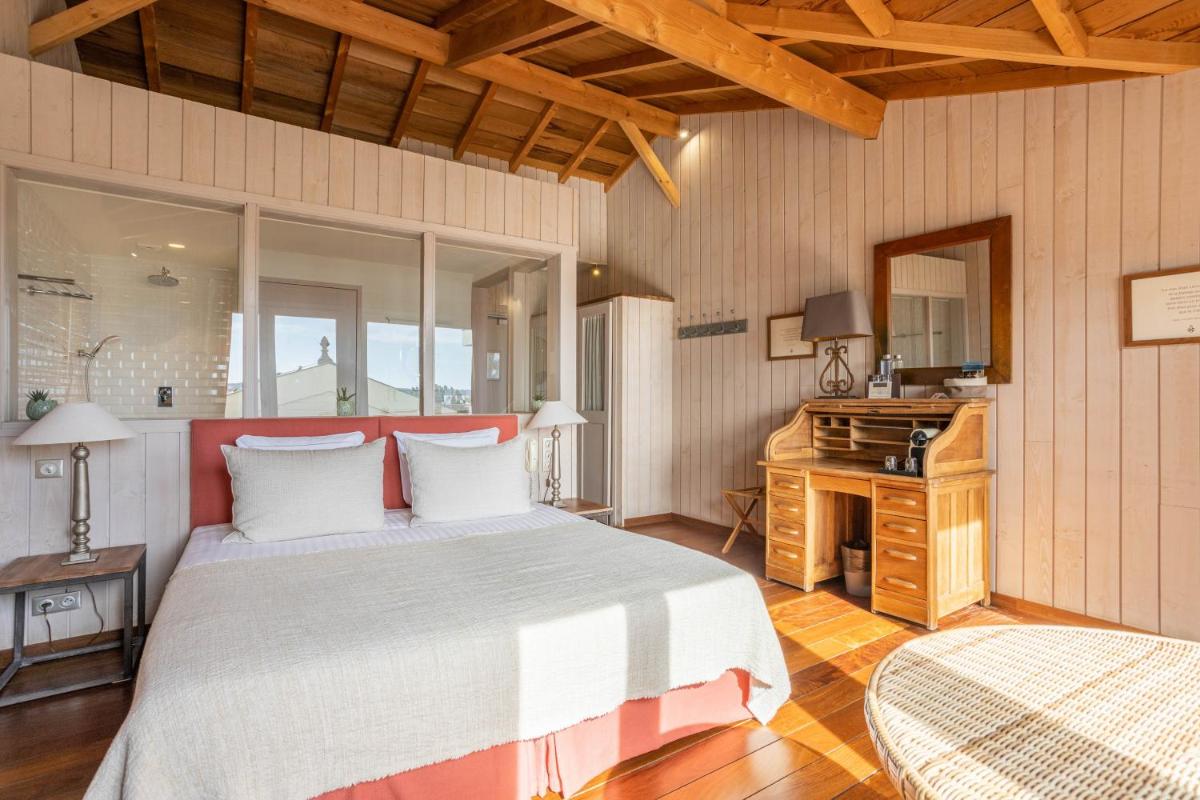 Un ou plusieurs lits dans un hébergement de l'établissement Hôtel Côté Sable