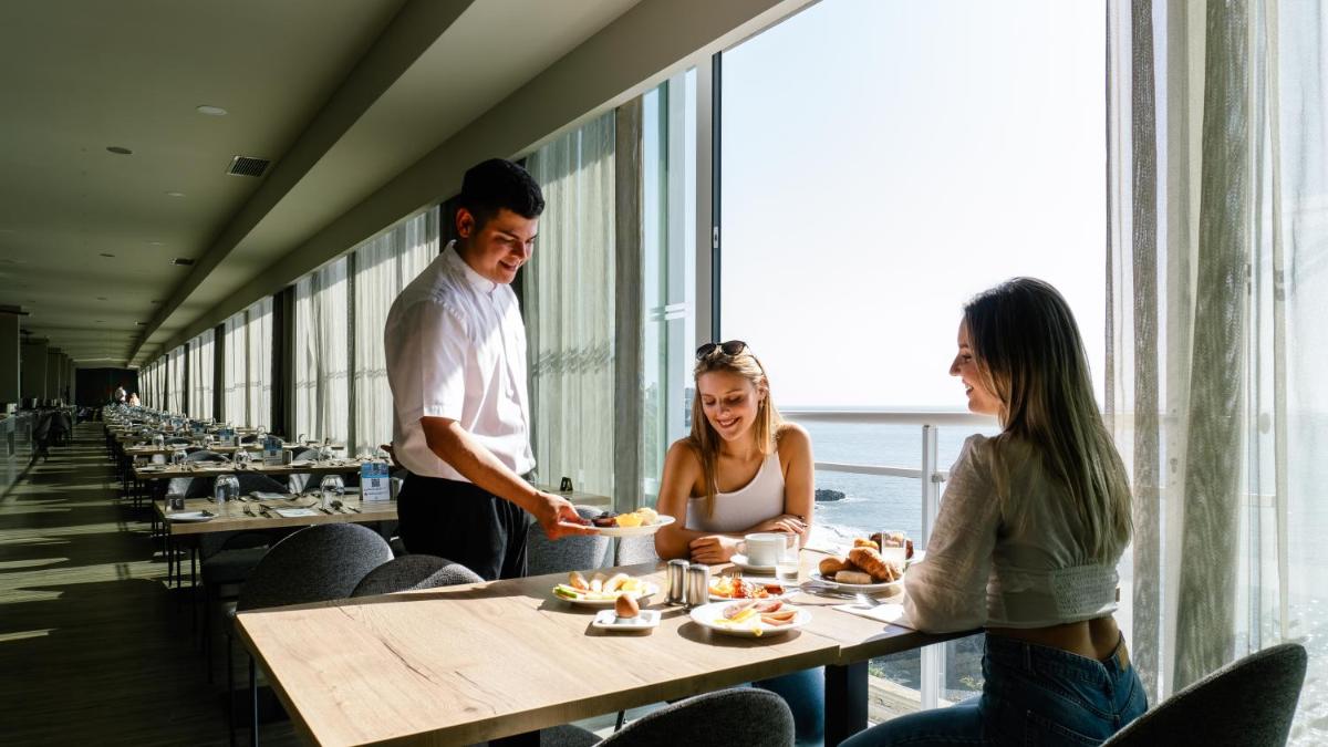Os clientes hospedados em Hotel Orca Praia
