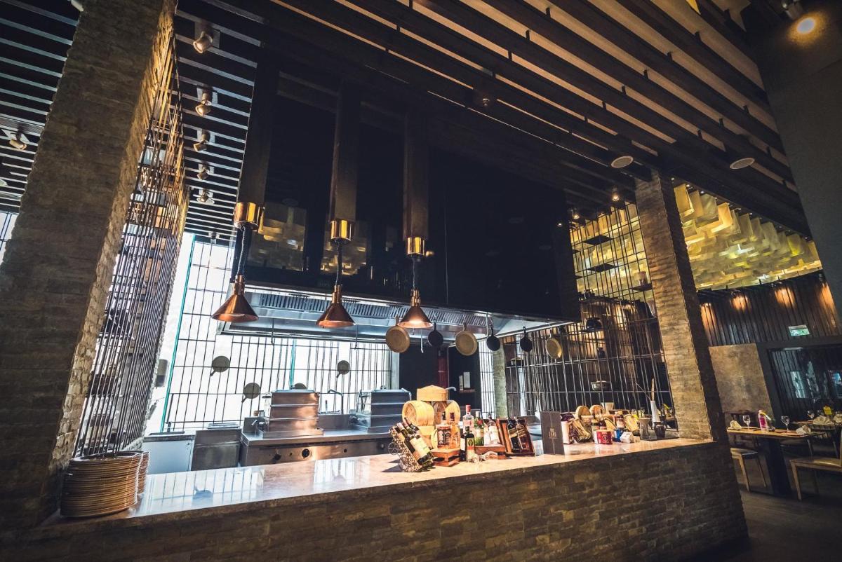 a kitchen with a counter with pots and pans at Holiday Inn Jaipur City Centre by IHG in Jaipur a kitchen with a counter with pots and pans at Holiday Inn Jaipur City Centre by IHG in Jaipur