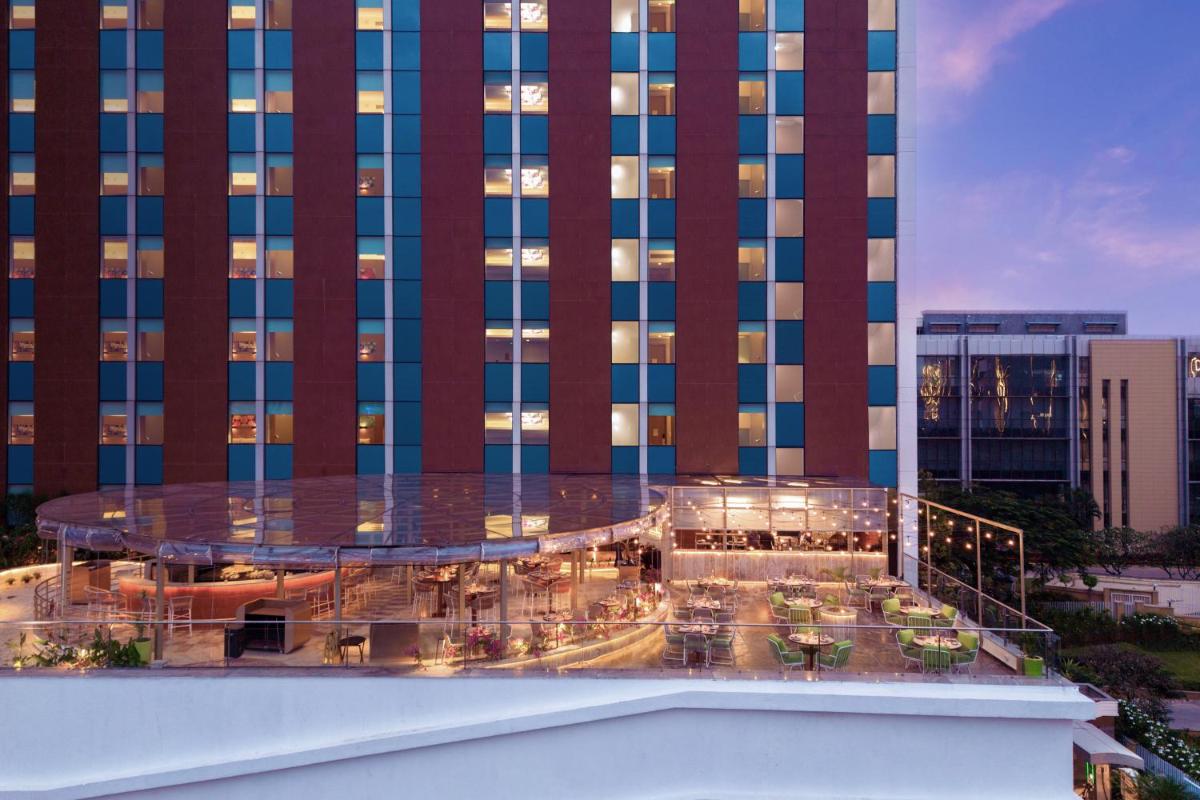 a view of a hotel with a building at Aloft Bengaluru Outer Ring Road in Bengaluru