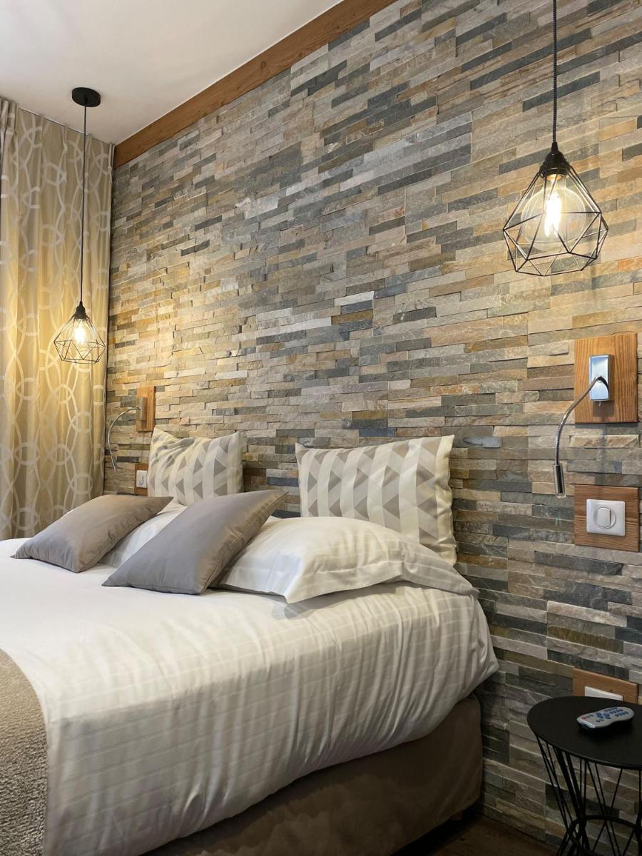 Un ou plusieurs lits dans un hébergement de l'établissement Hôtel des Princes, Chambéry Centre