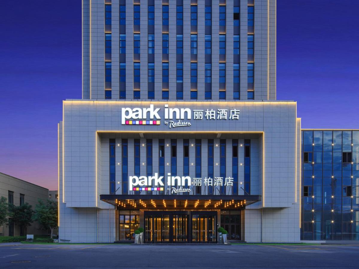 Park Inn by Radisson Tianjin Jinghai Wanda Plaza - Housity