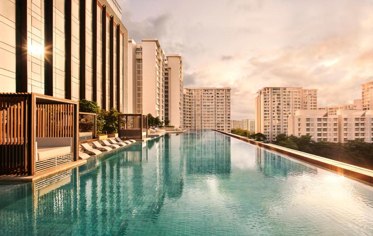 a large pool of blue water with tall buildings at Taj The Trees, Mumbai in Mumbai a large pool of blue water with tall buildings at Taj The Trees, Mumbai in Mumbai