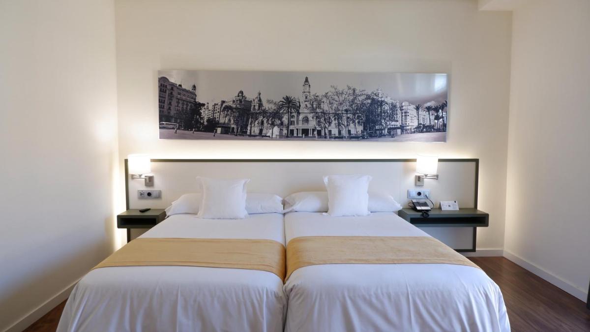 Cama o camas de una habitación en Primus Valencia