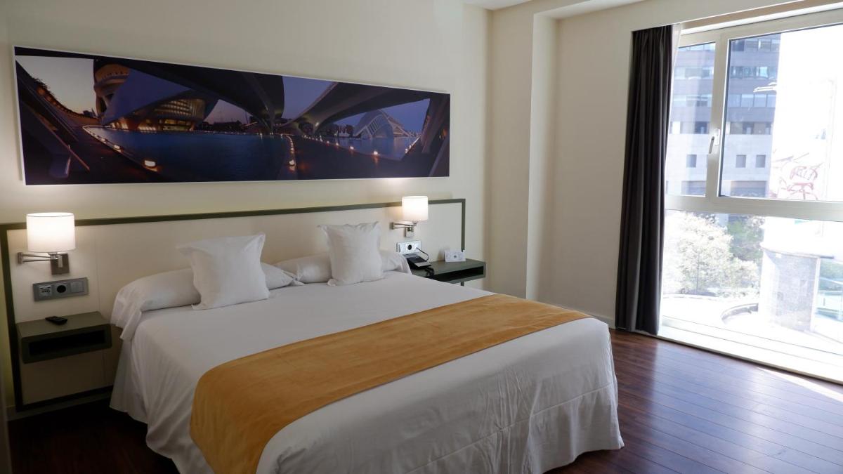 Cama o camas de una habitación en Primus Valencia