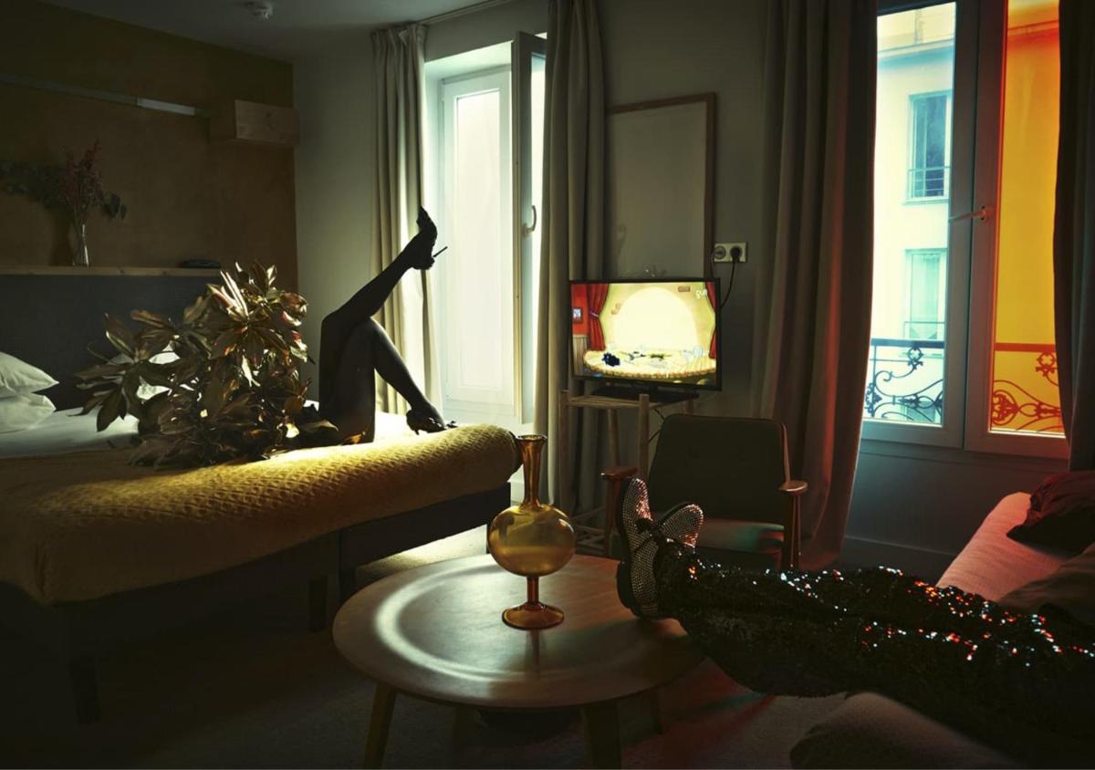 Télévision ou salle de divertissement dans l'établissement Hôtel La Nouvelle République & Hammam